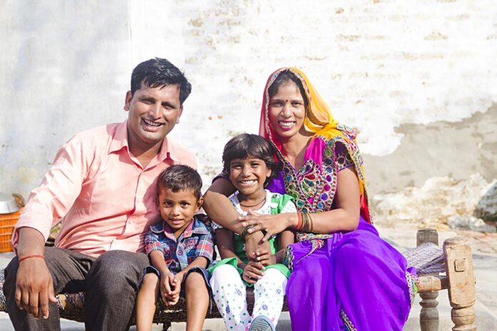 Happy Village couple with two children