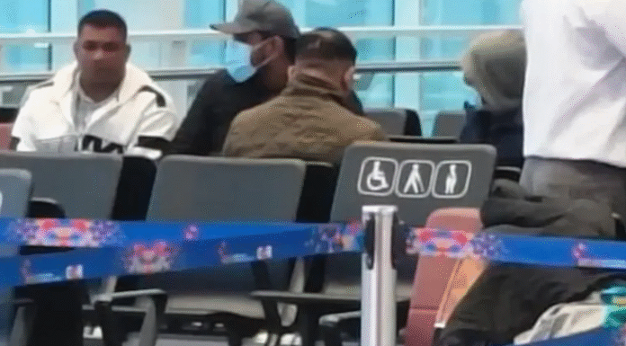 The Luthra brothers sit under police supervision at Delhi airport during their transit to Goa, where they are set to face charges linked to the deadly nightclub fire. (PC: NDTV)