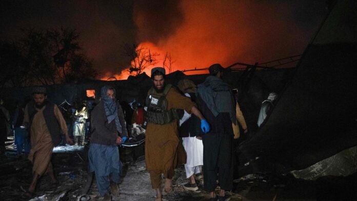 Rescue teams search through the rubble of a damaged building in Kabul following a deadly airstrike amid escalating Afghanistan-Pakistan tensions. (PC: AFP)