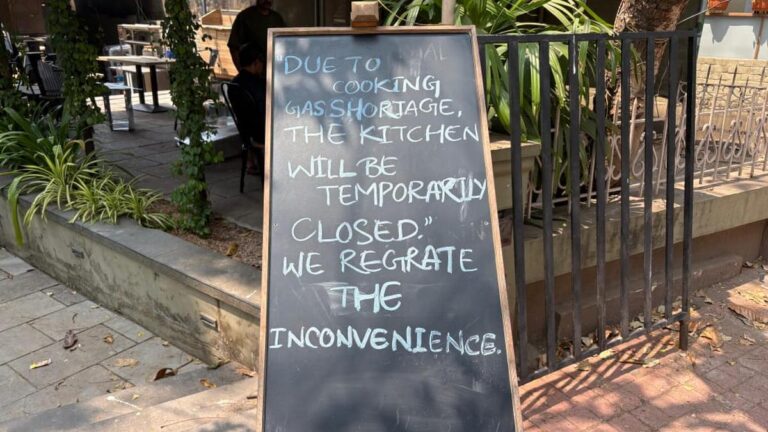 A restaurant in Kannur displays a handwritten notice announcing the temporary closure of its kitchen due to cooking gas shortage. (PC: special arrangement)